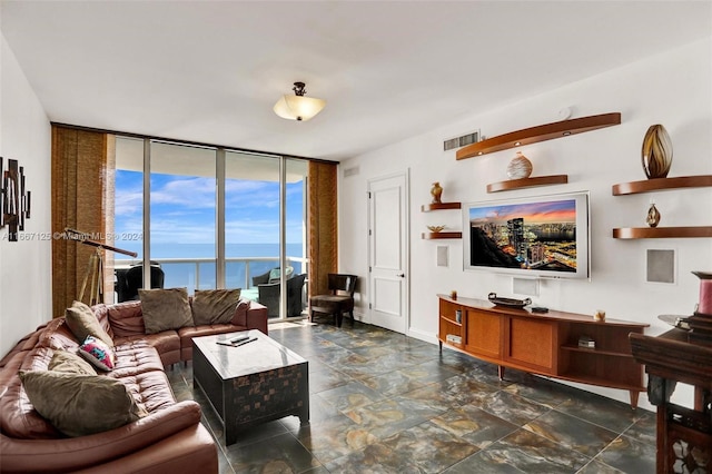 living room featuring floor to ceiling windows