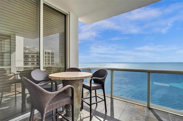 balcony featuring a water view