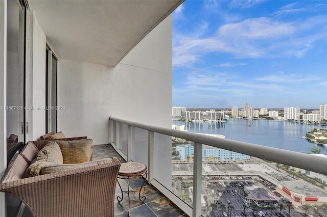 balcony featuring a water view