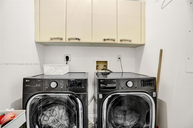 laundry room with cabinets and separate washer and dryer