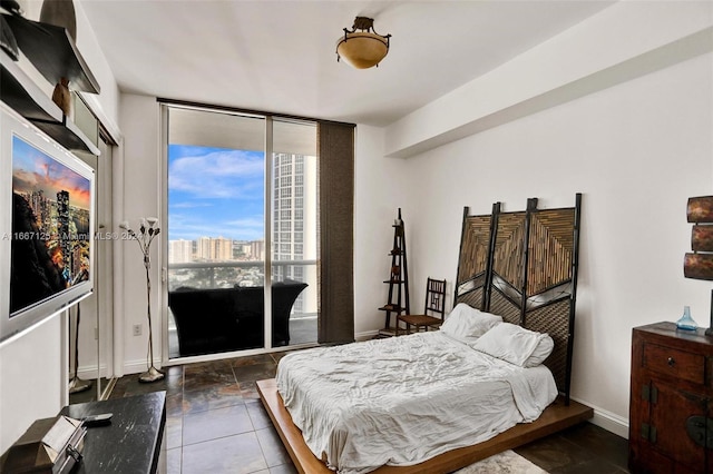 bedroom featuring expansive windows
