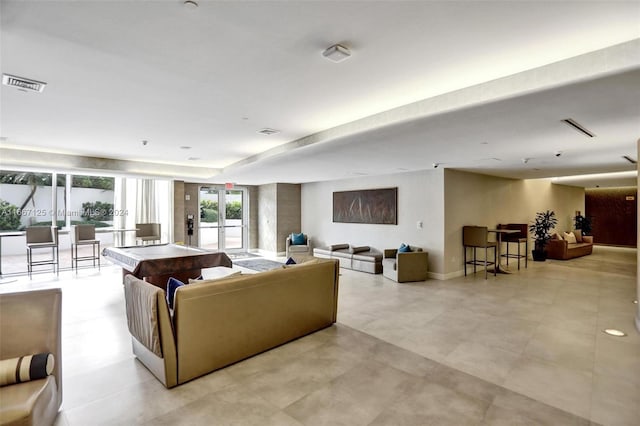 living room featuring french doors and billiards