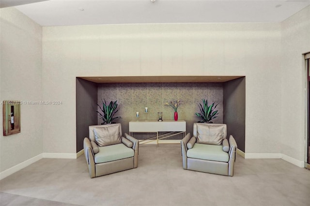 sitting room featuring baseboards
