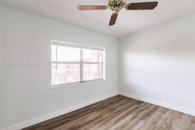 9460 Sunrise Lakes Blvd Unit 309, Sunrise, FL 33322 - spare room featuring wood finished floors, baseboards, a textured ceiling, and a ceiling fan