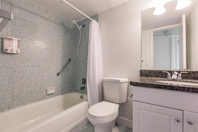 9460 Sunrise Lakes Blvd Unit 309, Sunrise, FL 33322 - full bathroom with shower / bath combination with curtain, vanity, toilet, baseboards, and tile patterned floors