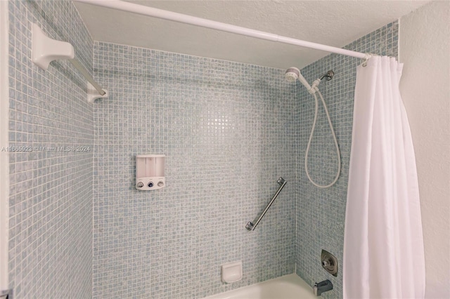 bathroom with shower / bath combination with curtain