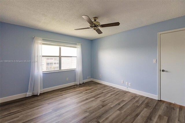 9460 Sunrise Lakes Blvd Unit 309, Sunrise, FL 33322 - unfurnished room with a ceiling fan, wood finished floors, a textured ceiling, and baseboards