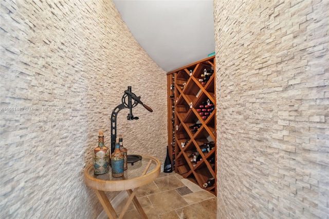 wine area with vaulted ceiling