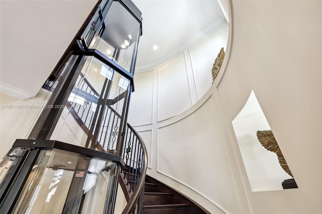 stairway with a towering ceiling