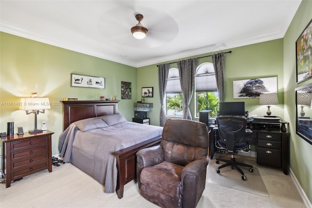 bedroom with ceiling fan, ornamental molding, and light carpet