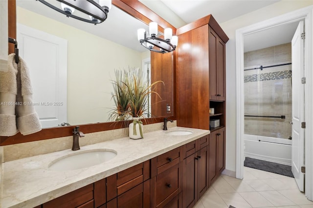 bathroom featuring vanity, shower / bath combination with glass door, and tile patterned floors