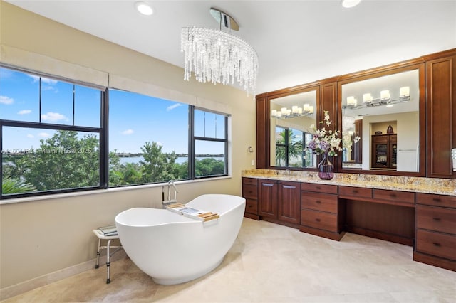 bathroom with a bathtub and vanity