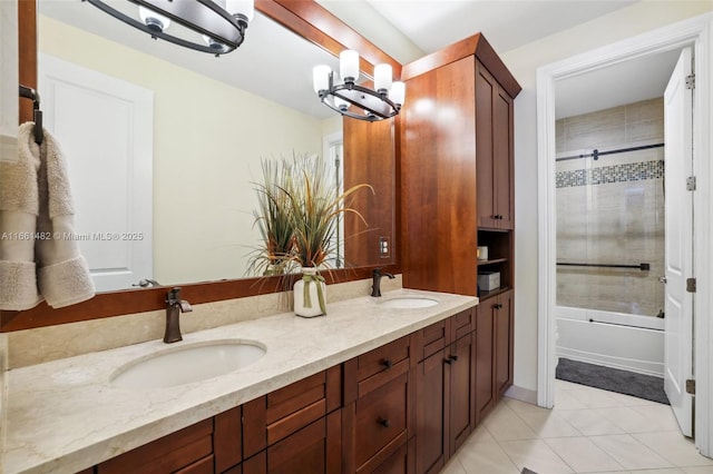 bathroom featuring vanity, tile patterned flooring, and shower / bath combination with glass door