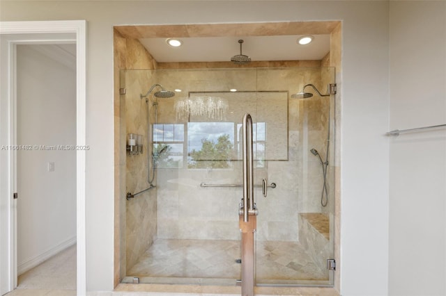 bathroom featuring a shower with door