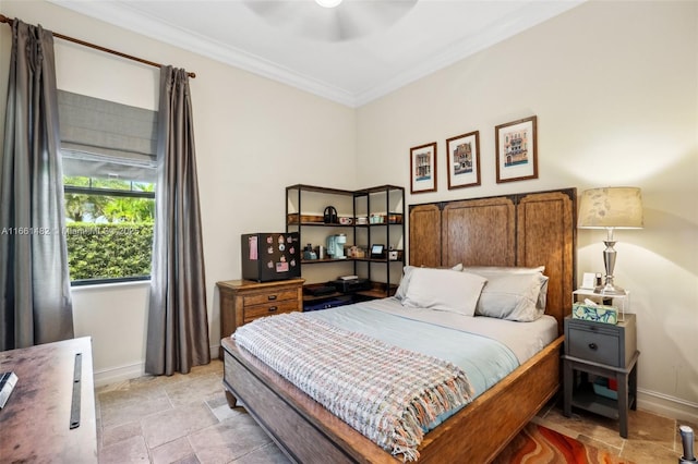 bedroom with ceiling fan and crown molding