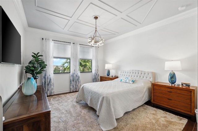 bedroom with coffered ceiling, a chandelier, ornamental molding, and hardwood / wood-style flooring