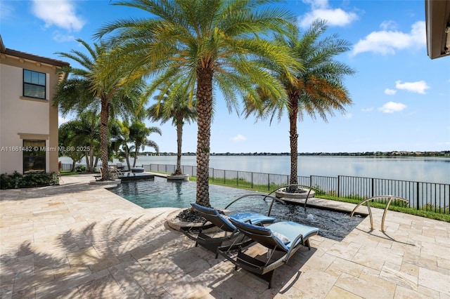 exterior space with a fenced in pool and a water view