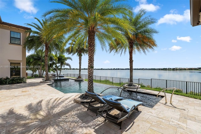 exterior space featuring a water view and a fenced in pool