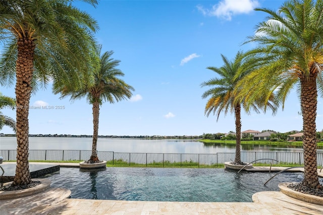 view of pool with a water view