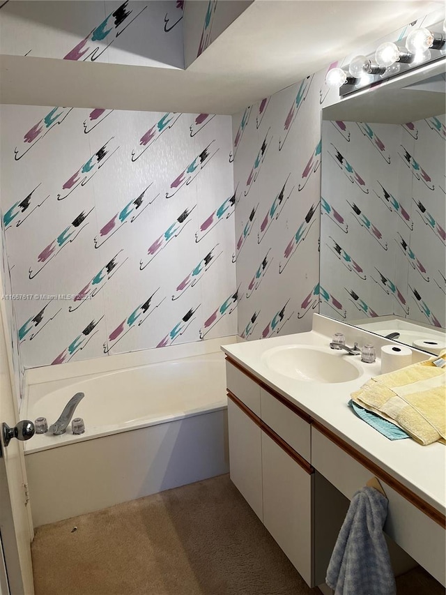 bathroom featuring vanity and a tub