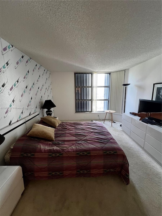 carpeted bedroom with a textured ceiling