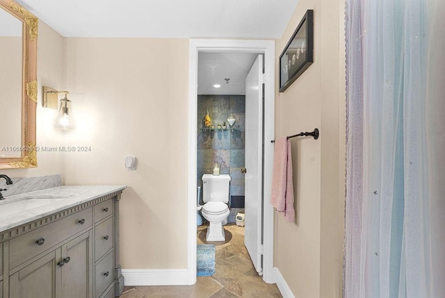 bathroom with vanity and toilet