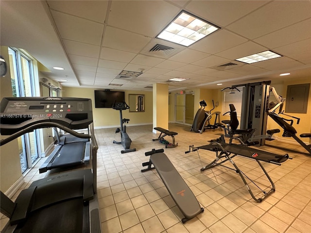 exercise room with a drop ceiling