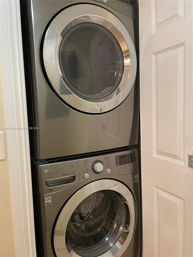 laundry room with stacked washer and dryer