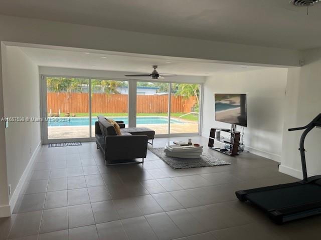 living room featuring light tile patterned floors and ceiling fan