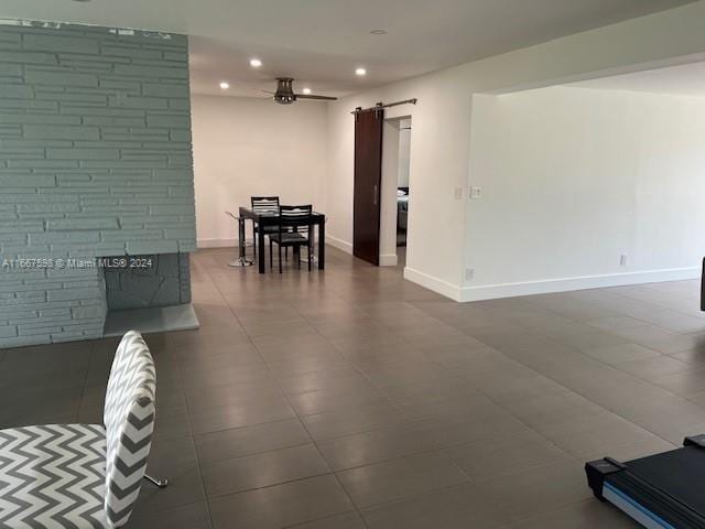 tiled living room with a barn door