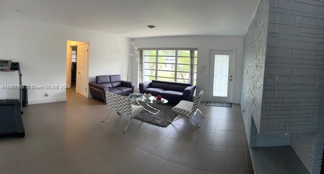 living room featuring lofted ceiling