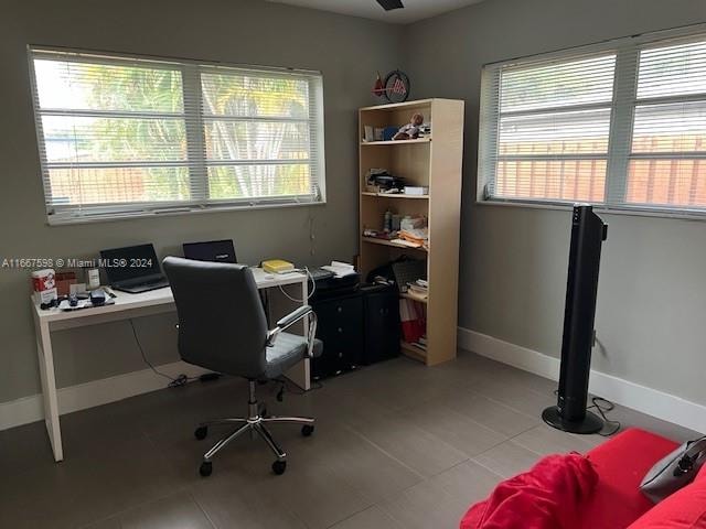 office featuring light tile patterned floors and plenty of natural light