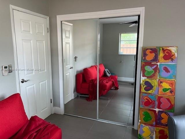 interior space featuring dark tile patterned flooring