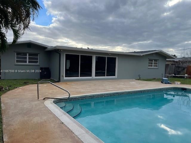 back of property featuring a patio