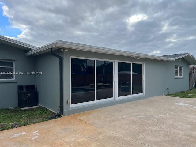 rear view of property with a patio area