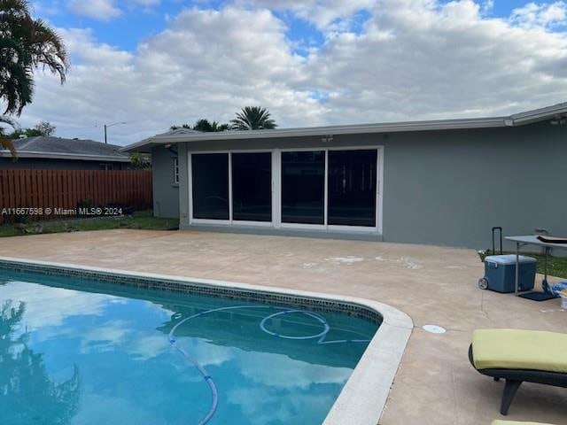 view of swimming pool with a patio area