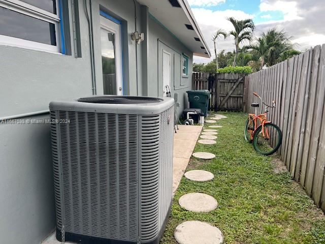 view of yard featuring central air condition unit