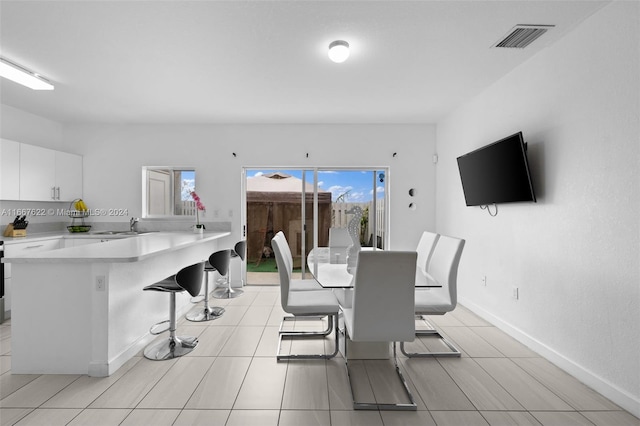 dining area featuring sink