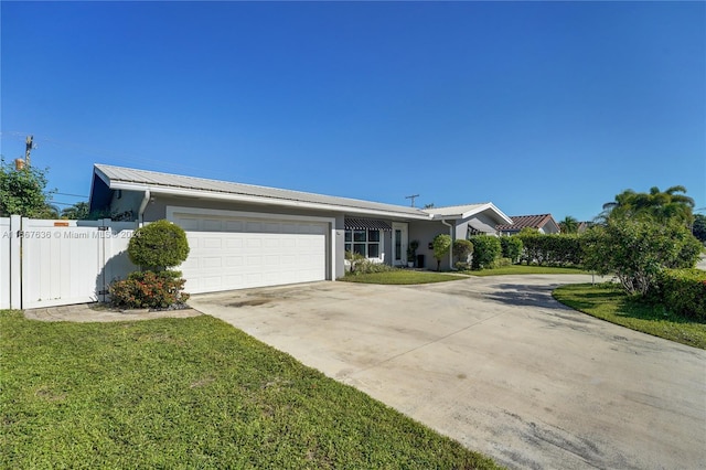 single story home featuring a front yard and a garage