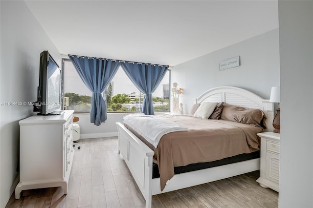 bedroom featuring light wood-type flooring