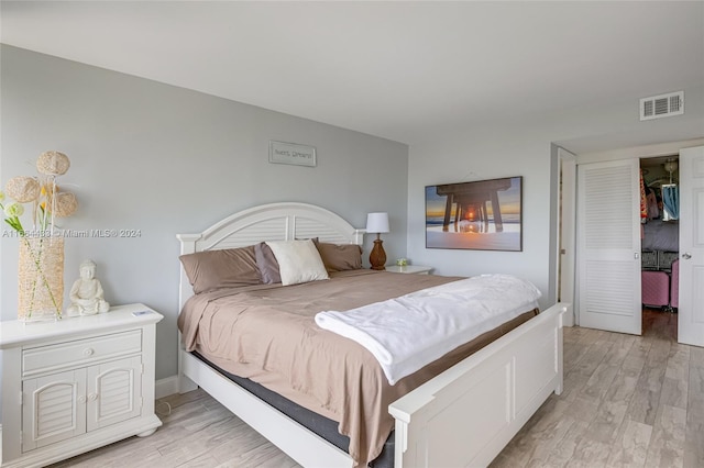 bedroom featuring light wood-type flooring