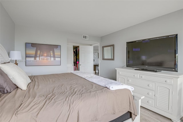 bedroom with light wood-type flooring