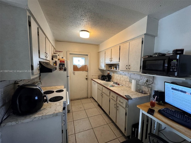 kitchen featuring a textured ceiling, tasteful backsplash, ventilation hood, white appliances, and light tile patterned floors