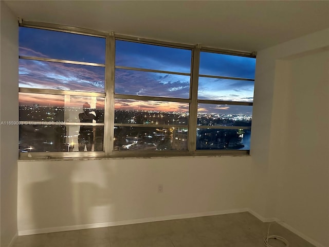 unfurnished room with tile patterned flooring