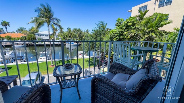 balcony featuring a water view