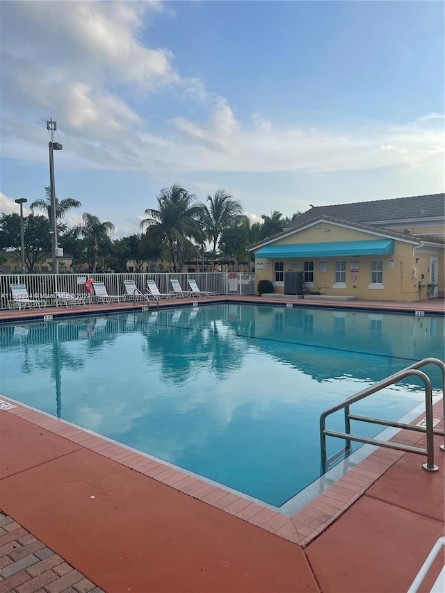 view of swimming pool featuring a patio area