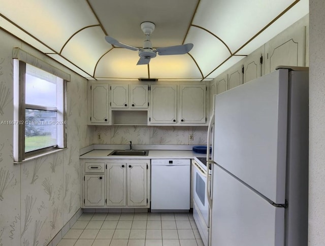 kitchen with ceiling fan, sink, light tile patterned floors, and white appliances