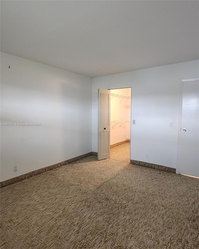 spare room with carpet floors