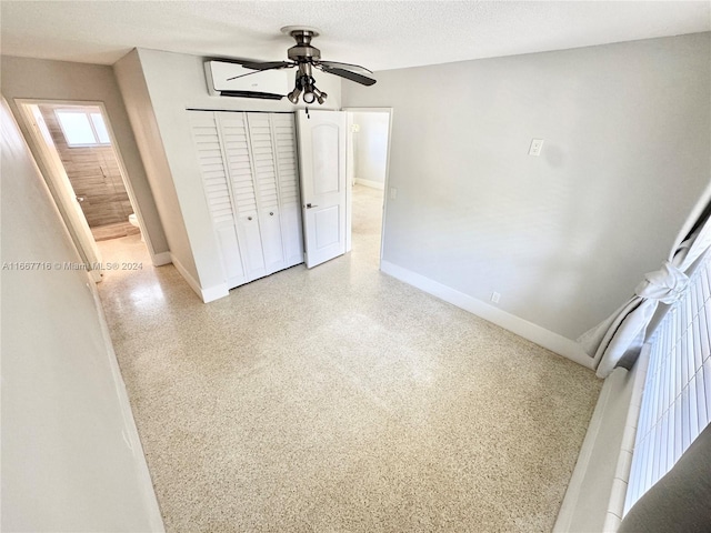 empty room featuring a textured ceiling and ceiling fan