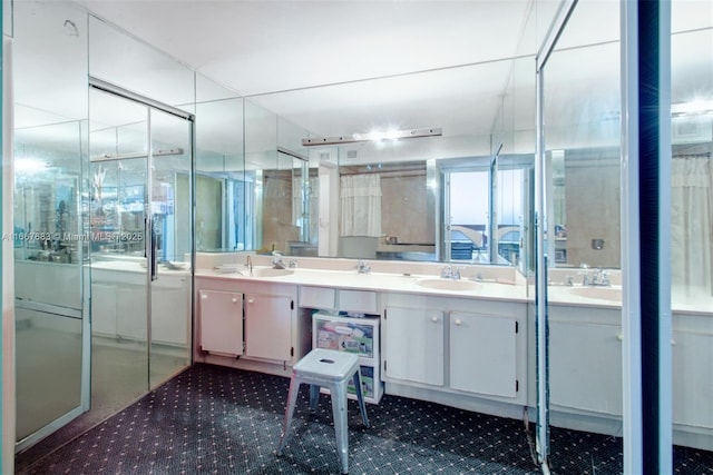 bathroom with double vanity and a sink